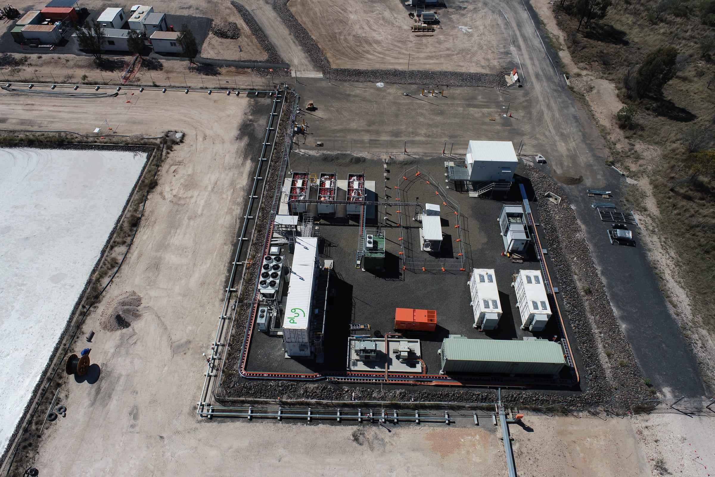 Drone view of a completed energy plant compound with containers and equipment