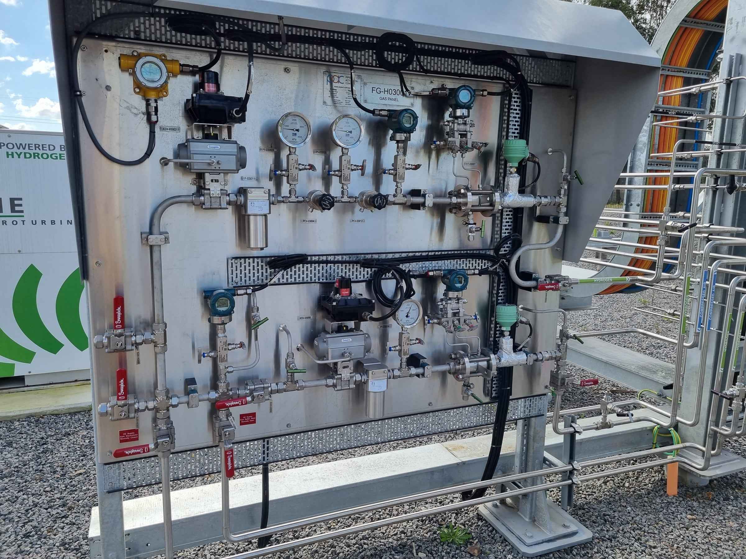 Hydrogen gas panel with pressure gauges, valves and stainless steel tubing on site