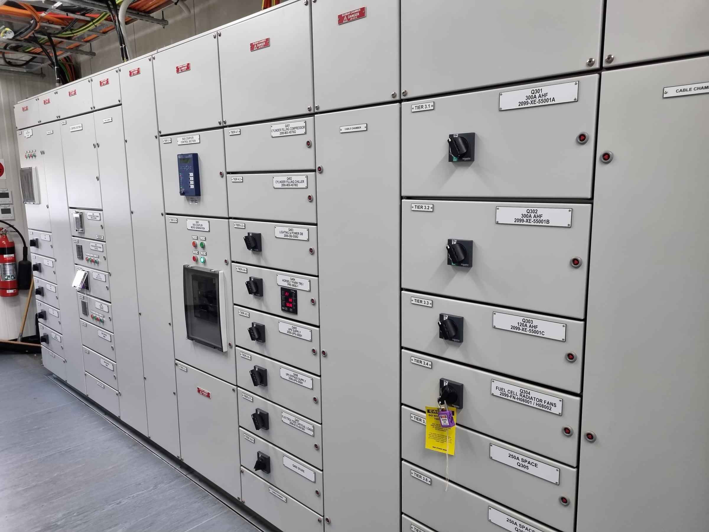 Row of electrical switchboards and motor control panels
