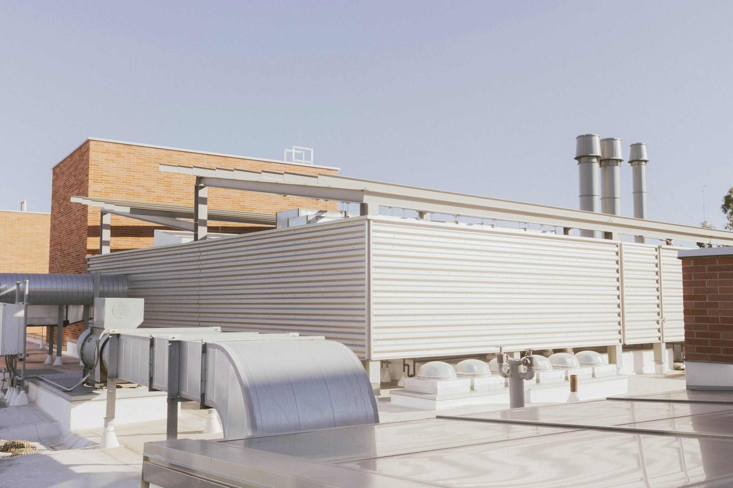 Rooftop mechanical plant and exhaust stacks on a building